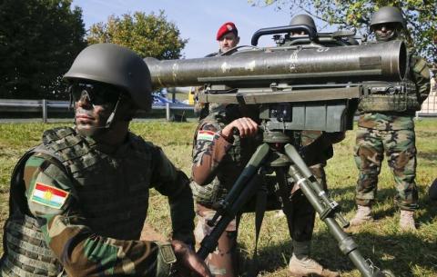 A Peshmerga fighter kneels next to a French-German anti-tank light infantry missile MILAN during a training session at the Bundeswehr army training site of Hammelburg near the northern Bavarian city of Wuerzburg, October 2, 2014. PHOTO BY REUTERS/Wolfgang Rattay