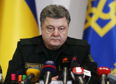 Ukraine's President Petro Poroshenko talks to military staff in Kiev, February 14, 2015. PHOTO BY REUTERS/Valentyn Ogirenko