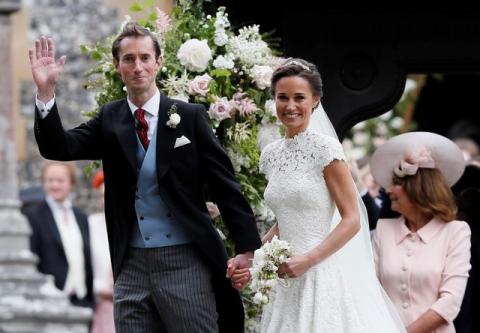 Pippa Middleton and James Matthews smile after their wedding at St Mark's Church in Englefield, Britain May 20, 2017. Pippa Middleton is the sister of Catherine, Duchess of Cambridge. PHOTO BY REUTERS/Kirsty Wigglesworth