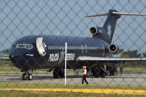 Members of the gendarmerie stand at the back door of a Federal Police airplane bound for La Havana, Cuba, as Cuban citizens are being deported from Mexico, at the international airport in Tapachula, Mexico, January 20, 2017. PHOTO BY REUTERS/Jose Torres