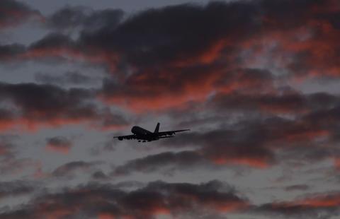 A passenger aircraft makes it's final landing approach towards Heathrow Airport at dawn in west London Britain, April 18, 2016. PHOTO BY REUTERS/Toby Melville