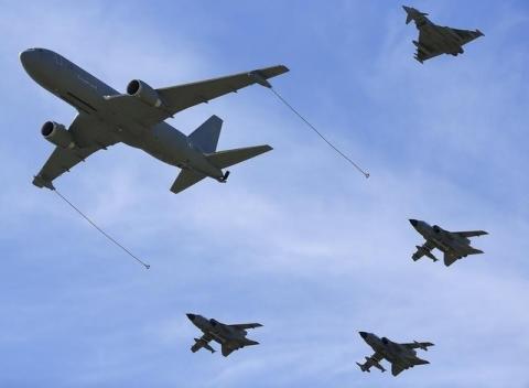 Military planes fly in formation during a NATO military exercise at the Birgi NATO Airbase in Trapani, Italy, October 19, 2015. PHOTO BY REUTERS/Tony Gentile