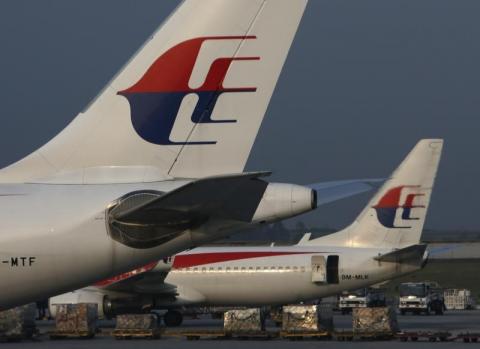 Malaysia Airlines planes sit on the tarmac at Kuala Lumpur International Airport, July 21, 2014. PHOTO BY REUTERS/Edgar Su