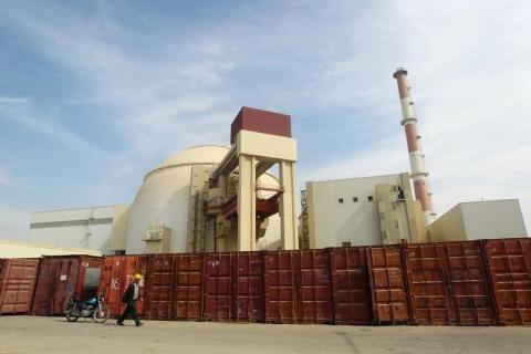A Russian worker walks past the Bushehr nuclear power plant, 1,200 km (746 miles) south of Tehran