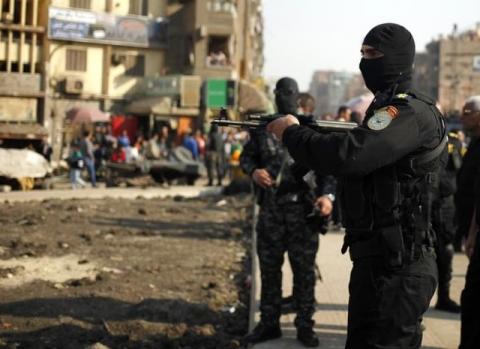 Police stand guard for possible protests in the eastern suburb of Mataryia in Cairo, November 28, 2014. PHOTO BY REUTERS/Asmaa Waguih