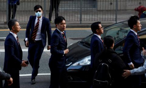 Five of the seven police officers, charged in connection with the beating of a protester during Occupy Central pro-democracy demonstrations, arrive at a court in Hong Kong, China, February 14, 2017. PHOTO BY REUTERS/Bobby Yip