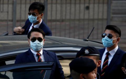 Three of the seven police officers, Police Constable Lau Hing-pui (front L), Wong Wai-ho (R) and Chan Siu-tan (back), charged in connection with the beating of a protester during Occupy Central pro-democracy demonstrations, arrive at a court in Hong Kong, China February 14, 2017. PHOTO BY REUTERS/Bobby Yip