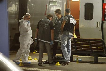 French investigating police check for clues on the train platform in Arras, France, August 21, 2015. PHOTO BY REUTERS/Pascal Rossignol