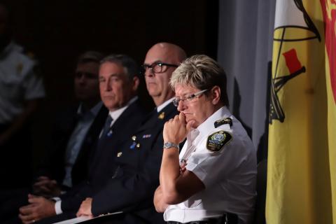 Fredericton Police Chief Leanne Fitch (R) listens to questions from reporters while addressing a news conference about shooting in Fredericton, New Brunswick, Canada, August 10, 2018. PHOTO BY REUTERS/Dan Culberso