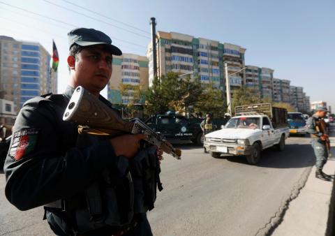 Afghan policemen stand guard at a checkpoint a day before parliamentary elections in Kabul, Afghanistan, October 19, 2018. PHOTO BY REUTERS/Omar Sobhani