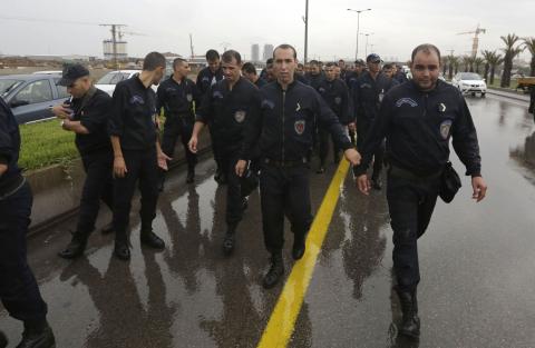Algeria police officers march during a protest in Algiers