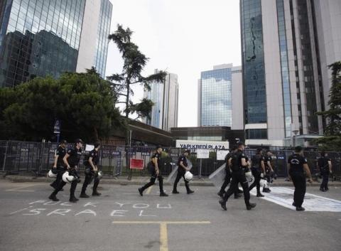 Turkish riot police walk outside the Israeli consulate before a protest against Israel's military action in Gaza, in Istanbul, July 21, 2014. PHOTO BY REUTERS/Osman Orsal