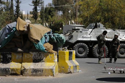 Police troopers secure the entrance of the U.S. embassy in Sanaa, February 11, 2015. PHOTO BY REUTERS/Khaled Abdullah