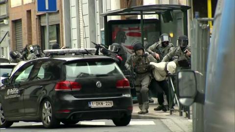 Armed Belgian police apprehend a suspect, in this still image taken from video, in Molenbeek, near Brussels, Belgium, March 18, 2016. PHOTO BY REUTERS/VTM via Reuters Tv