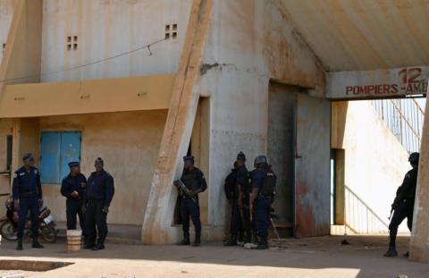 Policemen secure the municipal stadium where an emergency medical post was established, after a coordinated assault on the army headquarters and French embassy in the capital Ougadougou, Burkina Faso, March 2, 2018. PHOTO BY REUTERS/Anne Mimault