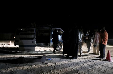 Policemen stand beside the microbus which carried Coptic Christians when gunmen opened fire in Menyia, Egypt, November 2, 2018. PHOTO BY REUTERS/Mohamed Abd El Ghany