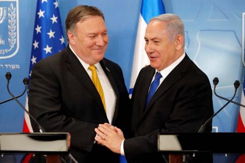 Israeli Prime Minister Benjamin Netanyahu shakes hands with U.S. Secretary of State Mike Pompeo during a meeting at the Ministry of Defence in Tel Aviv, Israel, April 29, 2018. Thomas Coex/Pool via Reuters