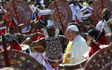 Pope Francis is greeted as he arrives at the Colombo airport, January 13, 2015. PHOTO BY REUTERS/Stefano Rellandini