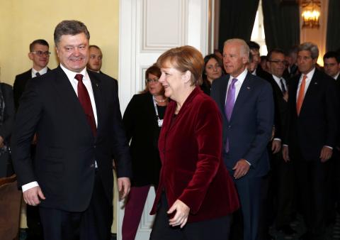 Ukraine's President Petro Poroshenko, German Chancellor Angela Merkel and U.S. Vice President Joe Biden arrive for a meeting as U.S. Secretary of State John Kerry (L-R) looks on during the 51st Munich Security Conference at the 'Bayerischer Hof' hotel in Munich, February 7, 2015. PHOTO BY REUTERS/Michaela Rehle
