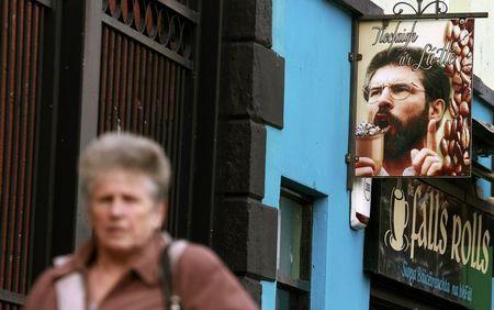 A sign showing Sinn Fein President Gerry Adams is displayed outside a coffee shop on the Falls Road in Belfast, Northern Ireland, September 11, 2015. PHOTO BY REUTERS/Cathal McNaughton