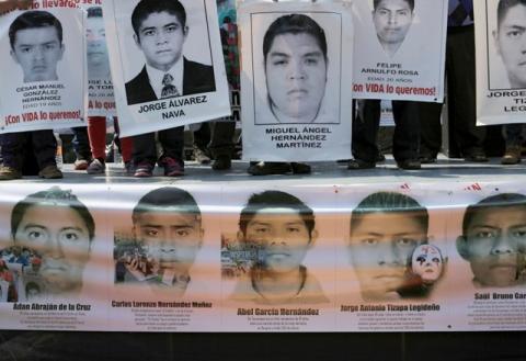 Relatives hold up posters during a rally in support of missing students from Ayotzinapa Teacher Training College, at the National Autonomous University of Mexico (UNAM) in Mexico City, February 19, 2015. PHOTO BY REUTERS/Henry Romero