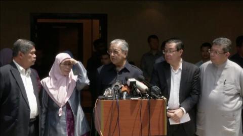 New Malaysian Prime Minister Mahathir Mohamad answers a question as he is flanked by Amanah president Mohamad Sabu, PKR president Wan Azizah Wan Ismail, and DAP secretary-general Lim Guan Eng during a news conference in Petaling Jaya, Selangor, Malaysia in this still image taken from video, May 11, 2018. PHOTO BY REUTERS