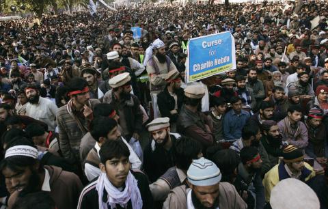 People protest against satirical French weekly newspaper Charlie Hebdo, which featured a cartoon of the Prophet Mohammad as the cover of its first edition since an attack by Islamist gunmen, in Lahore, January 18, 2015. PHOTO BY REUTERS/Mani Rana