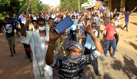 Sudanese demonstrators chant slogans as they march along the street during anti-government protests in Khartoum, Sudan, December 25, 2018. PHOTO BY REUTERS/Mohamed Nureldin Abdallah