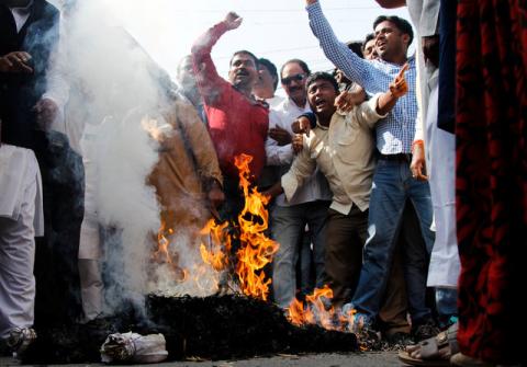 Protesters from India’s main opposition Congress party shout slogans as they burn an effigy of India’s Prime Minister Narendra Modi during a protest against the government's decision to withdraw 500 and 1000 Indian rupee banknotes from circulation, according to a media release, in Ajmer, India, November 17, 2016. PHOTO BY REUTERS/Himanshu Sharma