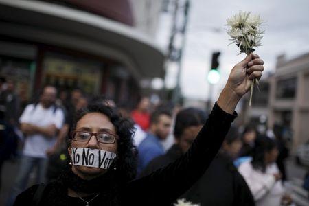A protester takes part in a protest against what protesters say is the death of Guatemalan democracy in Guatemala City, September 5, 2015. PHOTO BY REUTERS/Jose Cabezas