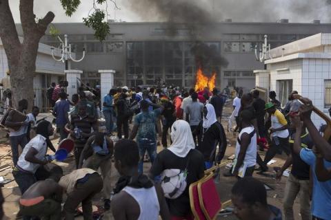 Anti-government protesters set fire to the parliament building in Ouagadougou, capital of Burkina Faso, October 30, 2014. PHOTO BY REUTERS/Joe Penney