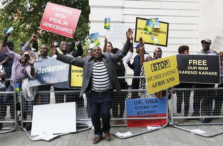 Protesters demanding the release of Rwanda's intelligence chief Karenzi Karake celebrate outside Westminster Magistrates Court after he was bailed for a bond of GB Pounds 1 Million in London, Britain, June 25, 2015. PHOTO BY REUTERS/Stefan Wermuth