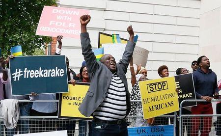 Protesters demanding the release of Rwanda's intelligence chief Karenzi Karake celebrate outside Westminster Magistrates Court after he was bailed for a bond of GB Pounds 1 Million in London, Britain, June 25, 2015. PHOTO BY REUTERS/Stefan Wermuth