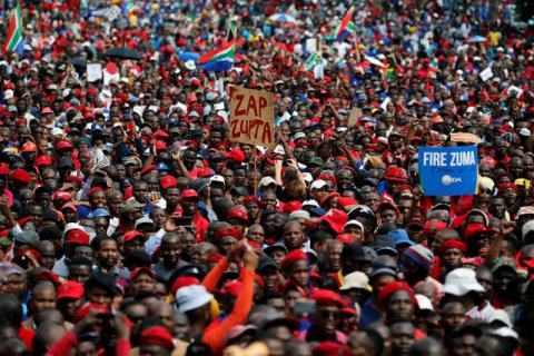 Protesters hold placards as they gather in South Africa's capital to protest against President Jacob Zuma in Pretoria, South Africa, April 12 ,2017. PHOTO BY REUTERS/Siphiwe Sibeko