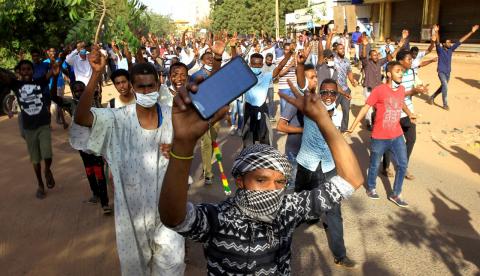 Sudanese demonstrators chant slogans as they march along the street during anti-government protests in Khartoum, Sudan, December 25, 2018. PHOTO BY REUTERS/Mohamed Nureldin Abdallah