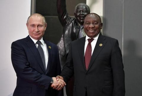 Russia's President Vladimir Putin (L) shakes hands with South Africa's President Cyril Ramaphosa at the BRICS summit in Johannesburg, South Africa, July 26, 2018. PHOTO BY REUTERS/Sputnik/Alexei Nikolsky/Kremlin 