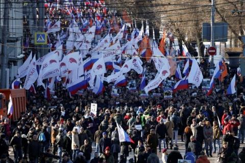 People take part in a rally in memory of Russian opposition politician Boris Nemtsov on the first anniversary of his murder in Moscow, Russia, February 27, 2016. PHOTO BY REUTERS/Sergei Karpukhin