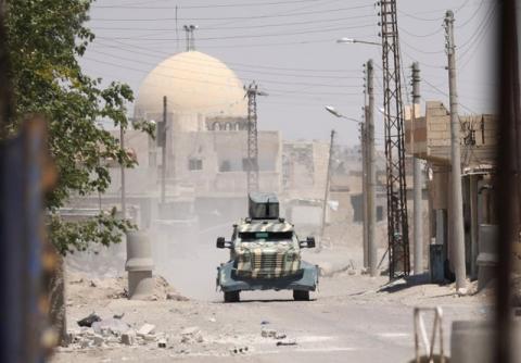 A military vehicle of SDF in west of Raqqa province, Syria June 18, 2017. PHOTO BY REUTERS/ Rodi Said