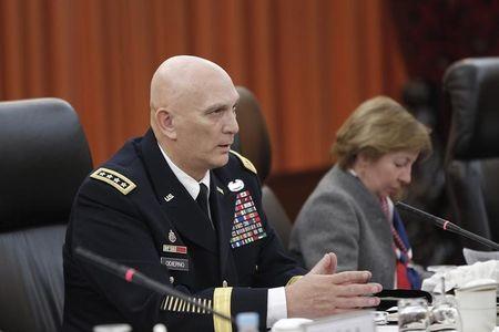 U.S. Army Chief of Staff General Ray Odierno (L) speaks during a meeting in Beijing, February 21, 2014. PHOTO BY REUTERS/Lintao Zhang