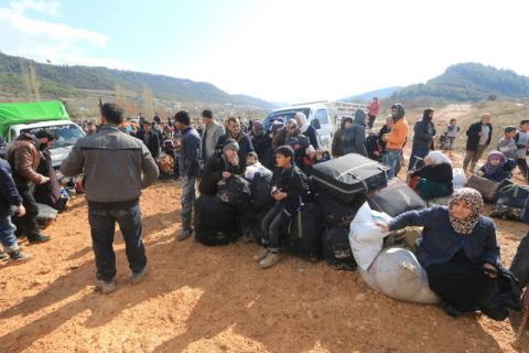 Internally displaced Syrians fleeing advancing pro-government Syrian forces wait near the Syrian-Turkish border after they were given permission by the Turkish authorities to enter Turkey, in Khirbet Al-Joz, Latakia countryside, February 2, 2016. PHOTO BY REUTERS/Ammar Abdullah