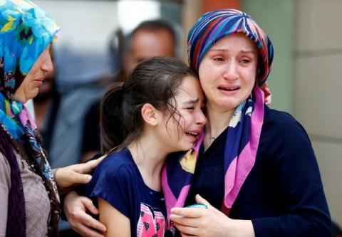 Relatives of one of the victims of yesterday's blast at Istanbul Ataturk Airport mourn in front of a morgue in Istanbul, Turkey, June 29, 2016. PHOTO BY REUTERS/Osman Orsal