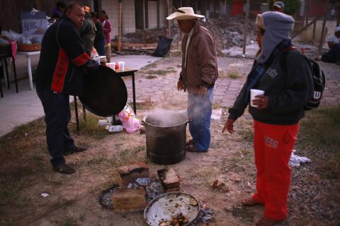 Relatives of the 43 missing students from the Ayotzinapa Teacher Training College drink coffee in the early morning before they begin the search for the missing students in Iguala, Guerrero, January 15, 2015. PHOTO BY REUTERS/Jorge Dan Lopez