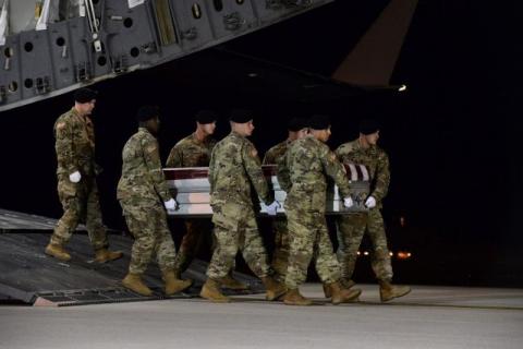 A U.S. Army carry team transfers the remains of Army Staff Sgt. Dustin Wright of Lyons, Georgia, at Dover Air Force Base in Delaware, U.S. on October 5, 2017. PHOTO BY REUTERS/Courtesy Aaron J. Jenne/U.S. Air Force