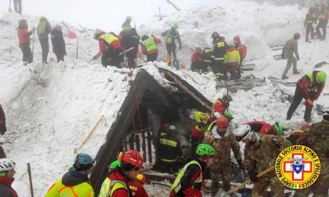 Rescue workers search around the Hotel Rigopiano in Farindola, central Italy, hit by an avalanche, in this undated picture released on January 22, 2017 provided by Alpine and Speleological Rescue Team. PHOTO BY REUTERS
