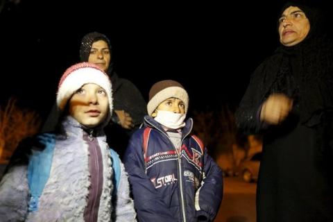 Residents who say they have received permission from the Syrian government to leave the besieged town, depart after an aid convoy entered Madaya, Syria, January 11, 2016. PHOTO BY REUTERS/Omar Sanadiki