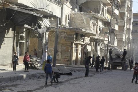 Residents inspect damage after an airstrike on the rebel held al-Fardous neighbourhood of Aleppo, Syria, February 18, 2016. PHOTO BY REUTERS/Abdalrhman Ismail
