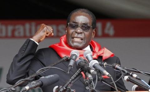 Zimbabwe President Robert Mugabe addresses supporters during celebrations to mark his 90th birthday in Marondera about 80km ( 50 miles) east of the capital Harare, February 23, 2014. PHOTO BY REUTERS/Philimon Bulawayo