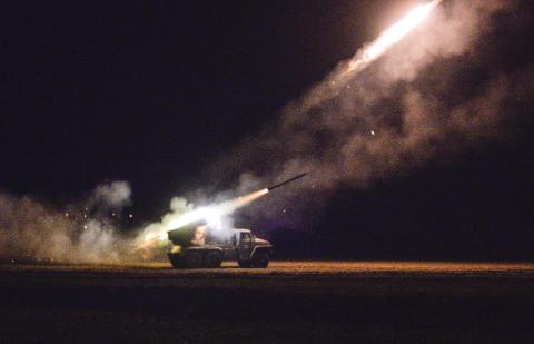 Ukrainian servicemen launch a Grad rocket towards pro-Russian separatist forces outside Debaltseve, eastern Ukraine, February 8, 2015. PHOTO BY REUTERS/Alexei Chernyshev