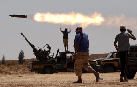 Anti-Gaddafi fighters fire a multiple rocket launcher near Sirte, September 24, 2011. PHOTO BY REUTERS/Goran Tomasevic