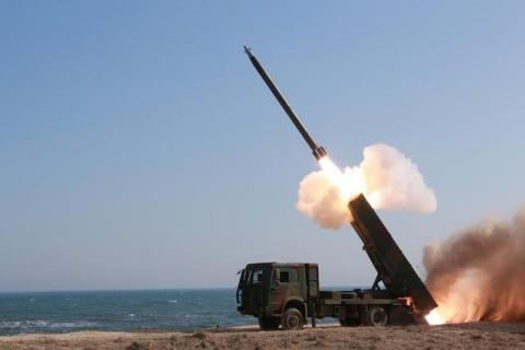 A rocket is launched during a demonstration of a new large-caliber multiple rocket launching system attended by North Korean leader Kim Jong Un (not pictured) at an unknown location, in this undated photo released by North Korea's Korean Central News Agency (KCNA) on March 22, 2016. PHOTO BY REUTERS/KCNA